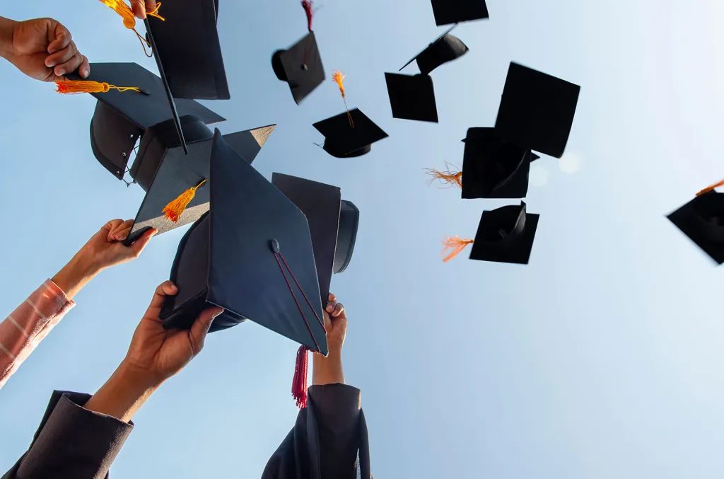 Graduation caps thrown into the sky